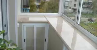 Остекление балкона с выносом под ключ